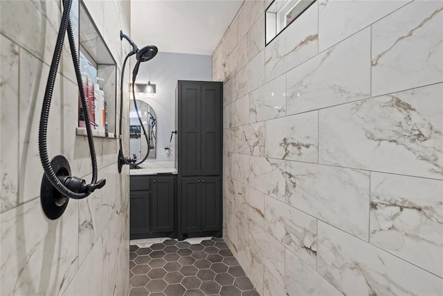1031 Colonial Ave, Tuttle, OK 73089 - bathroom featuring tile walls, vanity, and a tile shower