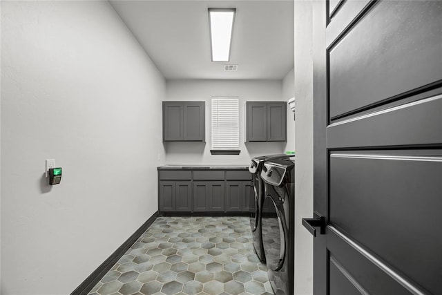 1031 Colonial Ave, Tuttle, OK 73089 - washroom featuring cabinet space, separate washer and dryer, and tile patterned floors