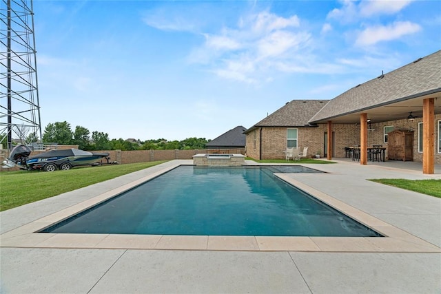 1031 Colonial Ave, Tuttle, OK 73089 - view of swimming pool featuring ceiling fan, a patio area, and a pool with connected hot tub