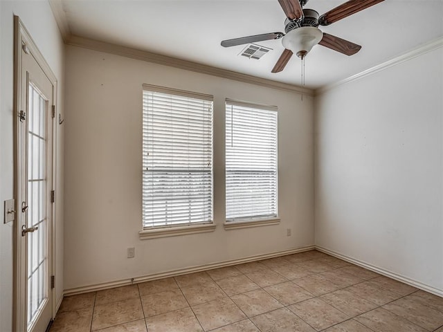 2909 Marigold Ln, Edmond, OK 73013 - empty room with plenty of natural light, a ceiling fan, light tile patterned flooring, and crown molding
