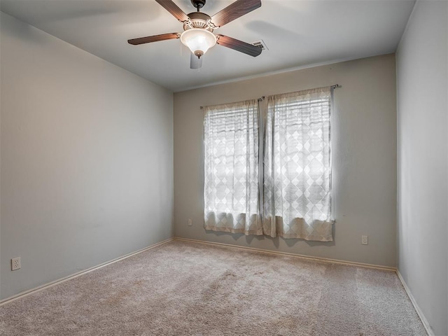 2909 Marigold Ln, Edmond, OK 73013 - spare room with carpet flooring and a ceiling fan