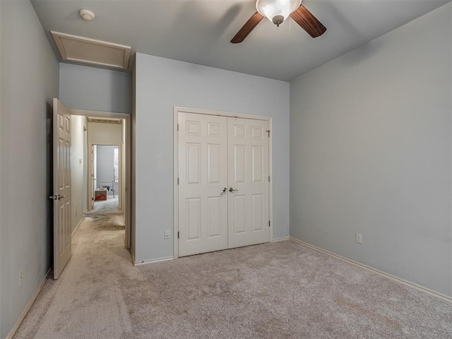 2909 Marigold Ln, Edmond, OK 73013 - unfurnished bedroom with carpet flooring, a closet, and a ceiling fan