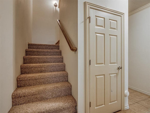 2909 Marigold Ln, Edmond, OK 73013 - stairway featuring crown molding and tile patterned flooring