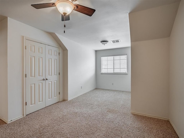 2909 Marigold Ln, Edmond, OK 73013 - unfurnished bedroom featuring light carpet, a closet, and ceiling fan