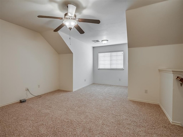 2909 Marigold Ln, Edmond, OK 73013 - bonus room featuring light carpet, a ceiling fan, and vaulted ceiling