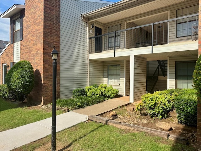 3000 Chautauqua Ave Unit 208, Norman, OK 73072 - view of side of property with a balcony and a chimney
