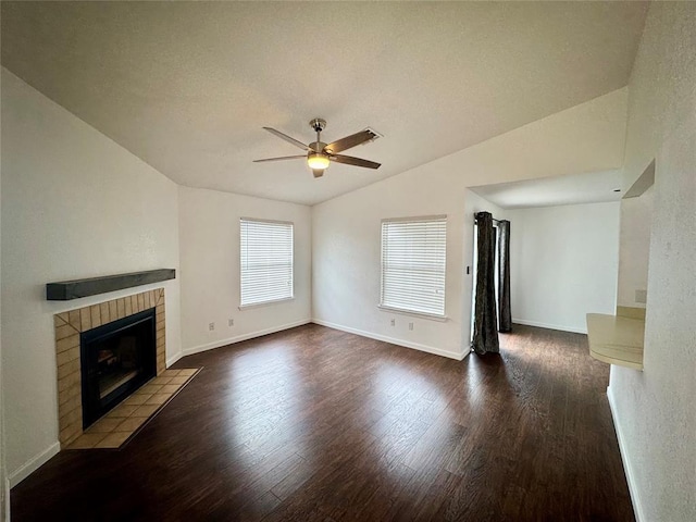 3000 Chautauqua Ave Unit 208, Norman, OK 73072 - unfurnished living room with ceiling fan, wood finished floors, lofted ceiling, and a tiled fireplace