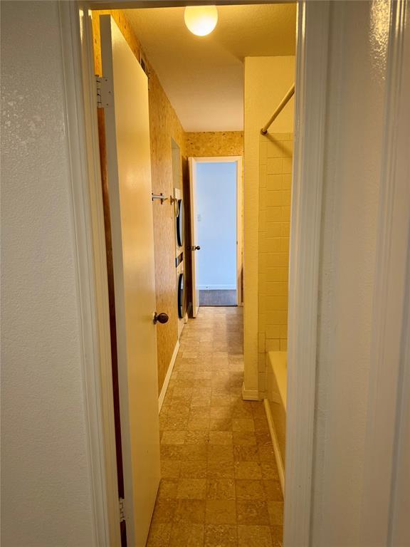 3000 Chautauqua Ave Unit 208, Norman, OK 73072 - hallway featuring tile patterned floors