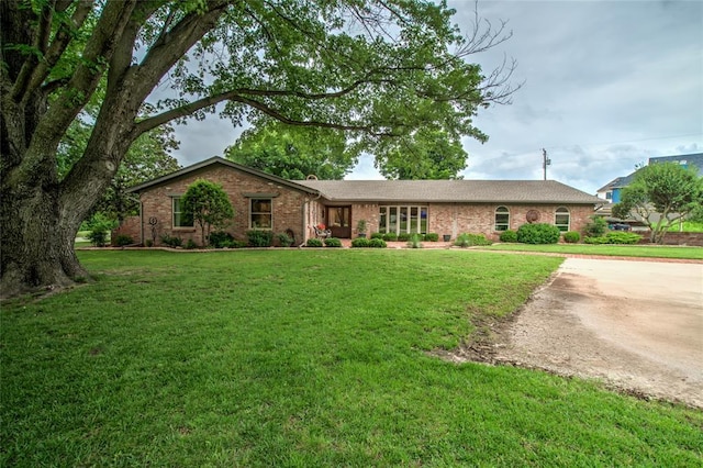 15700 N Western Ave, Edmond, OK 73013 - ranch-style house with brick siding and a front yard