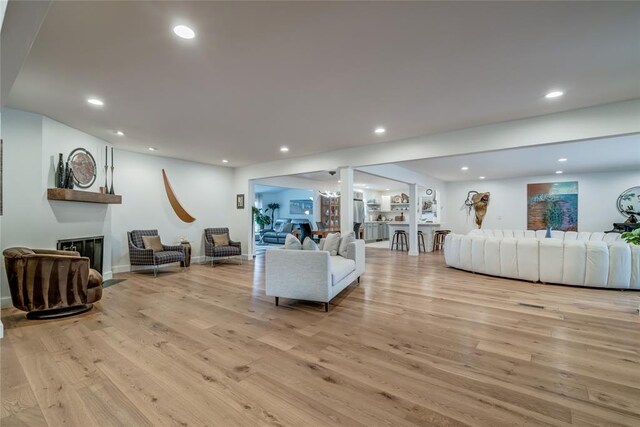 15700 N Western Ave, Edmond, OK 73013 - living area with light wood finished floors, recessed lighting, and a glass covered fireplace