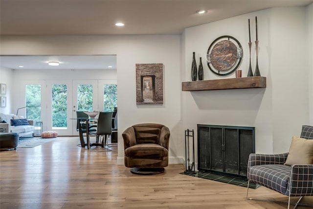 15700 N Western Ave, Edmond, OK 73013 - sitting room featuring wood finished floors, recessed lighting, and a fireplace with flush hearth