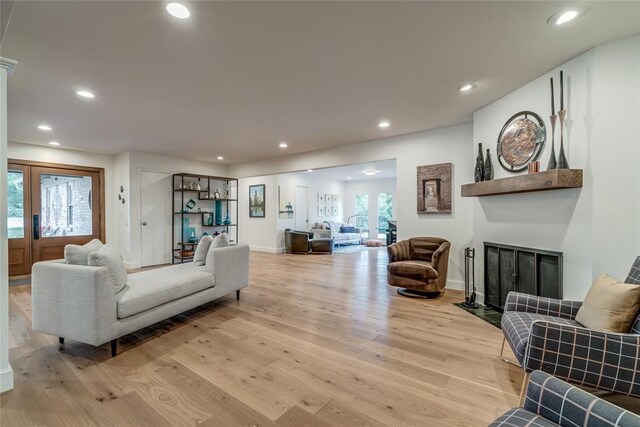 15700 N Western Ave, Edmond, OK 73013 - living area featuring light wood-style floors, recessed lighting, and a fireplace with flush hearth