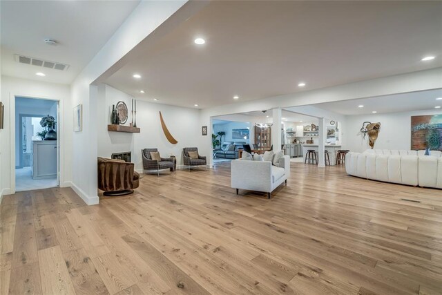 15700 N Western Ave, Edmond, OK 73013 - living area featuring light wood-style flooring, recessed lighting, and a fireplace