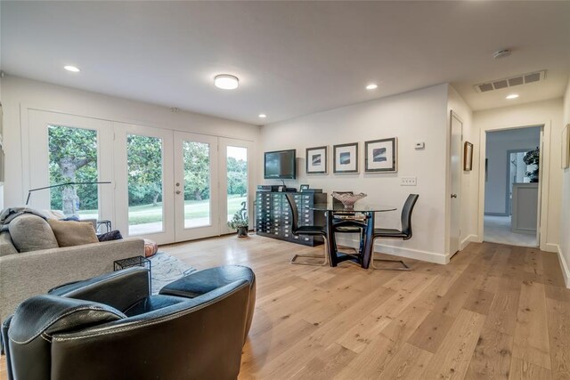 15700 N Western Ave, Edmond, OK 73013 - living room featuring light wood-style floors, french doors, and recessed lighting