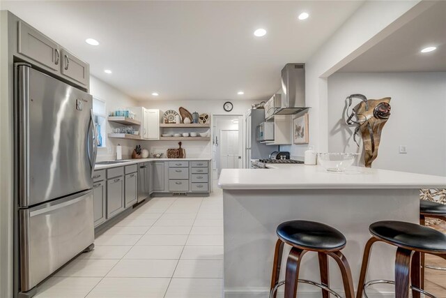 15700 N Western Ave, Edmond, OK 73013 - kitchen with stainless steel appliances, gray cabinets, exhaust hood, open shelves, and recessed lighting