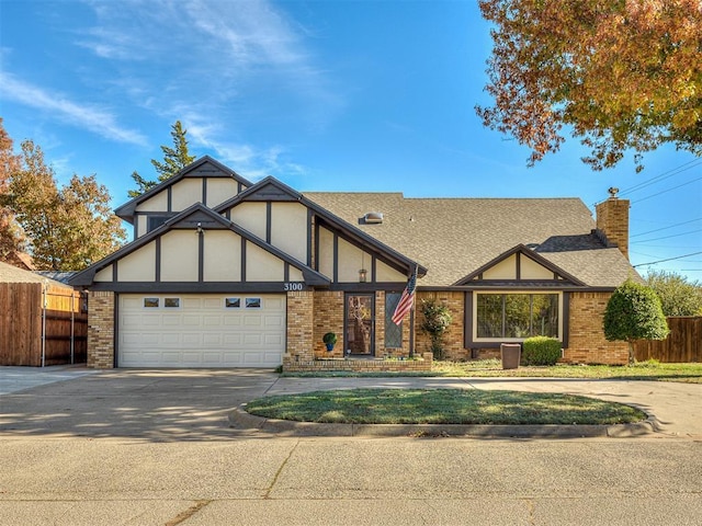 3100 N Eagle Ln, Bethany, OK 73008 - tudor house with brick siding, concrete driveway, and an attached garage