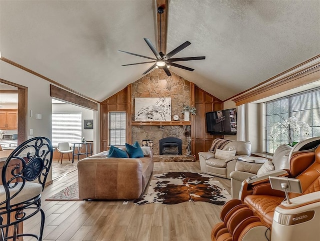 3100 N Eagle Ln, Bethany, OK 73008 - living room featuring a ceiling fan, light wood-style flooring, healthy amount of natural light, lofted ceiling, and crown molding