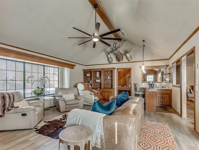 3100 N Eagle Ln, Bethany, OK 73008 - living area with healthy amount of natural light, ceiling fan, light wood-type flooring, ornamental molding, and high vaulted ceiling