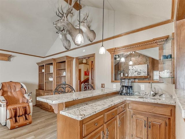 3100 N Eagle Ln, Bethany, OK 73008 - kitchen featuring lofted ceiling, ornamental molding, light stone counters, open shelves, and a peninsula