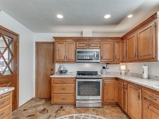 3100 N Eagle Ln, Bethany, OK 73008 - kitchen with stainless steel appliances, light stone finish floors, light stone counters, brown cabinets, and recessed lighting