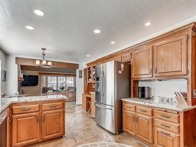 3100 N Eagle Ln, Bethany, OK 73008 - kitchen featuring stainless steel appliances, recessed lighting, a peninsula, brown cabinets, and hanging light fixtures