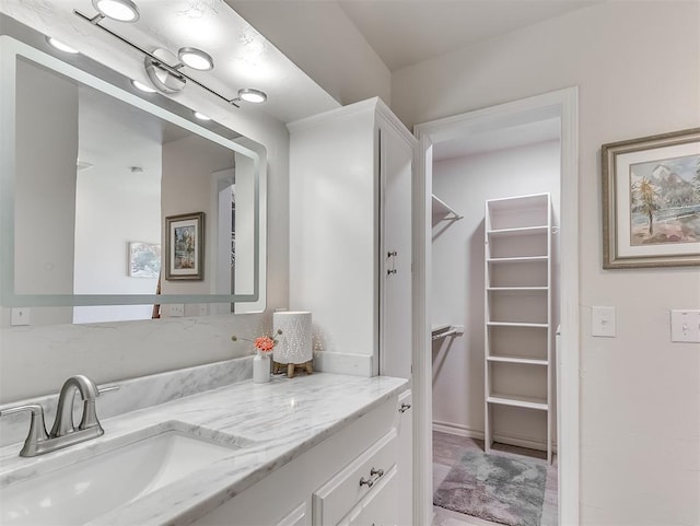 3100 N Eagle Ln, Bethany, OK 73008 - bathroom with vanity and a walk in closet