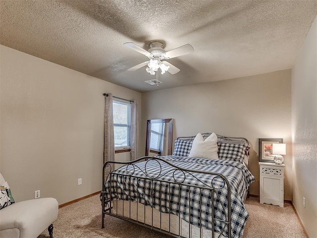 3100 N Eagle Ln, Bethany, OK 73008 - bedroom featuring light colored carpet, ceiling fan, and a textured ceiling