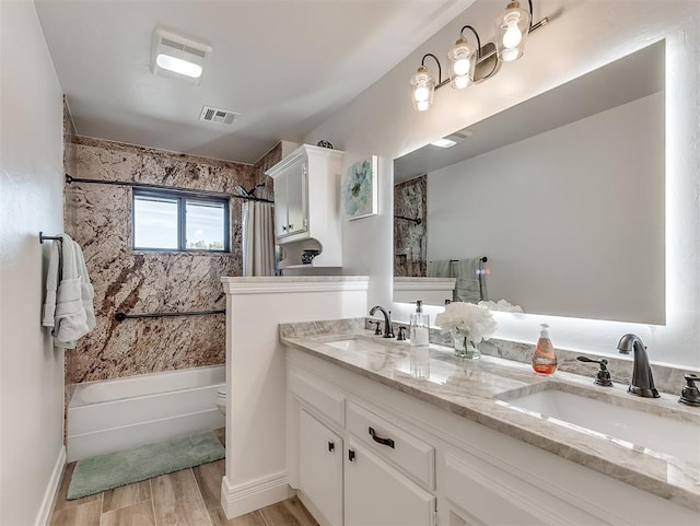 3100 N Eagle Ln, Bethany, OK 73008 - bathroom featuring shower / tub combo, double vanity, and wood finished floors
