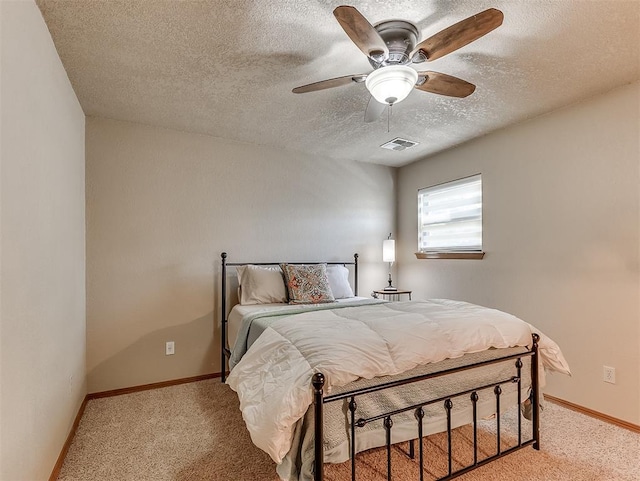 3100 N Eagle Ln, Bethany, OK 73008 - bedroom featuring a textured ceiling, light colored carpet, and ceiling fan