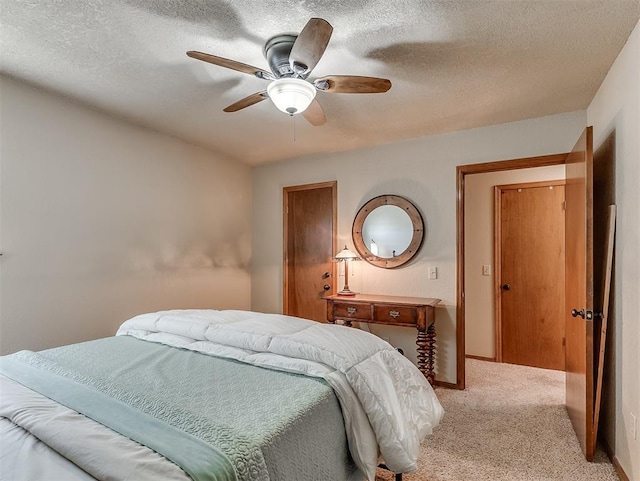 3100 N Eagle Ln, Bethany, OK 73008 - bedroom with light carpet, a textured ceiling, and ceiling fan