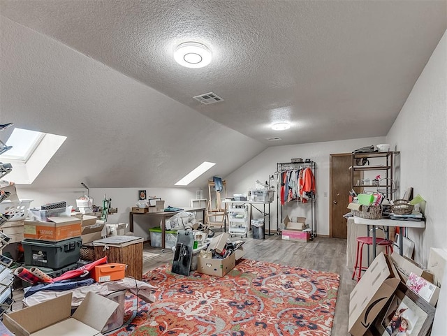 3100 N Eagle Ln, Bethany, OK 73008 - additional living space with a skylight, a textured ceiling, wood finished floors, and lofted ceiling