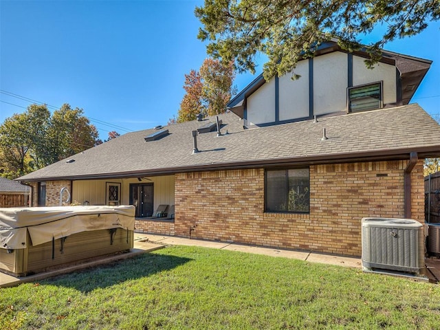 3100 N Eagle Ln, Bethany, OK 73008 - back of property with a hot tub, roof with shingles, and brick siding