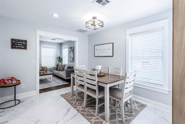 1218 N Brookline Ave, Oklahoma City, OK 73107 - dining area featuring marble finish floors and recessed lighting