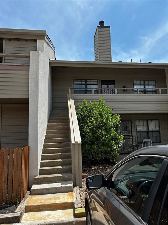 11130 Stratford Dr Unit 418, Oklahoma City, OK 73120 - view of building exterior featuring stairs