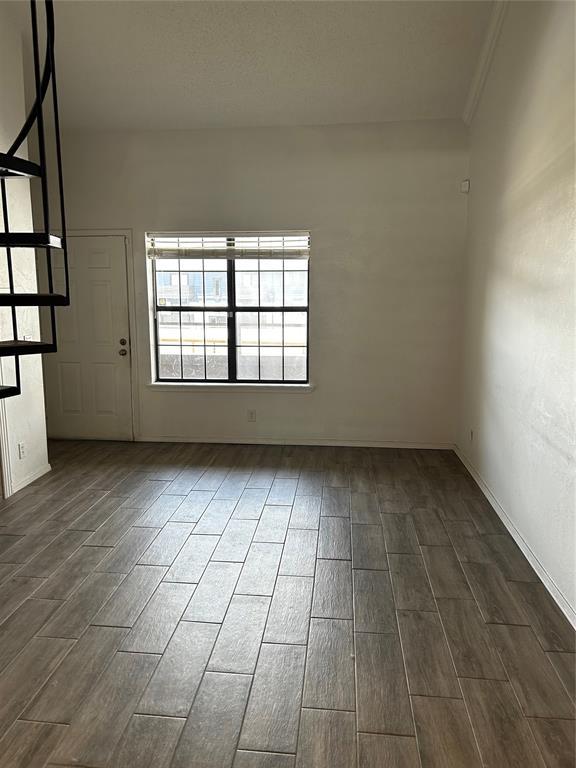 11130 Stratford Dr Unit 418, Oklahoma City, OK 73120 - spare room with dark wood-style floors