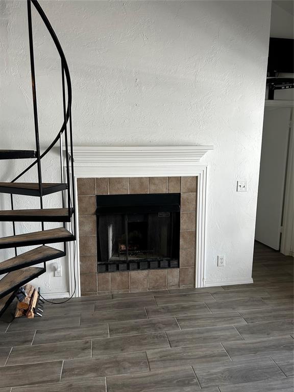 11130 Stratford Dr Unit 418, Oklahoma City, OK 73120 - detailed view of wood finished floors and a fireplace