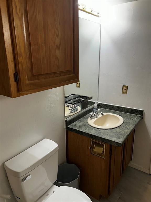 11130 Stratford Dr Unit 418, Oklahoma City, OK 73120 - bathroom featuring vanity and toilet