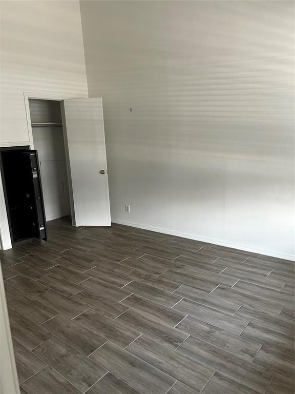 11130 Stratford Dr Unit 418, Oklahoma City, OK 73120 - unfurnished room with wood finish floors and baseboards