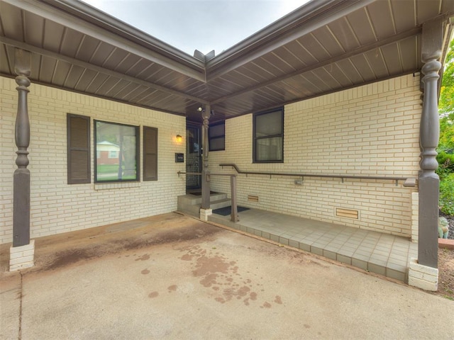 5936 N Ione Dr, Oklahoma City, OK 73122 - view of patio / terrace featuring an attached carport