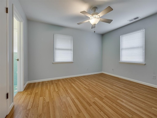 5936 N Ione Dr, Oklahoma City, OK 73122 - empty room with light wood-style flooring and a ceiling fan