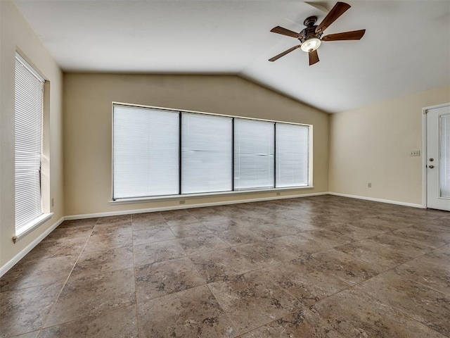 5936 N Ione Dr, Oklahoma City, OK 73122 - spare room with a ceiling fan, vaulted ceiling, and stone finish flooring