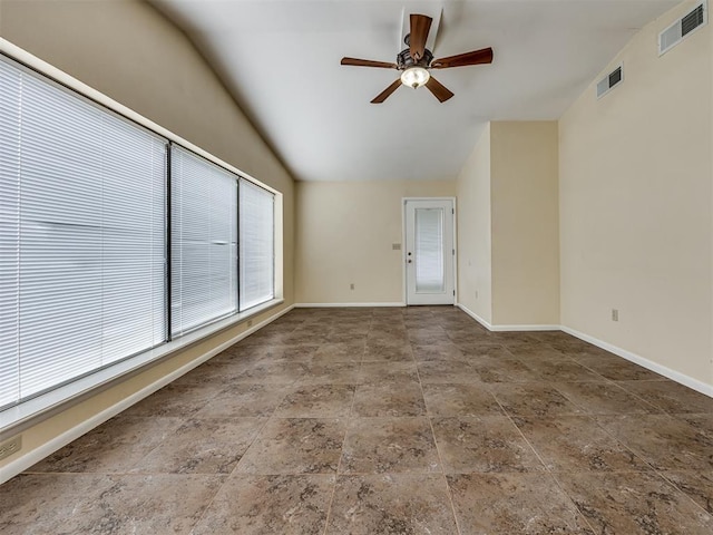 5936 N Ione Dr, Oklahoma City, OK 73122 - spare room with a ceiling fan, stone finish flooring, and lofted ceiling