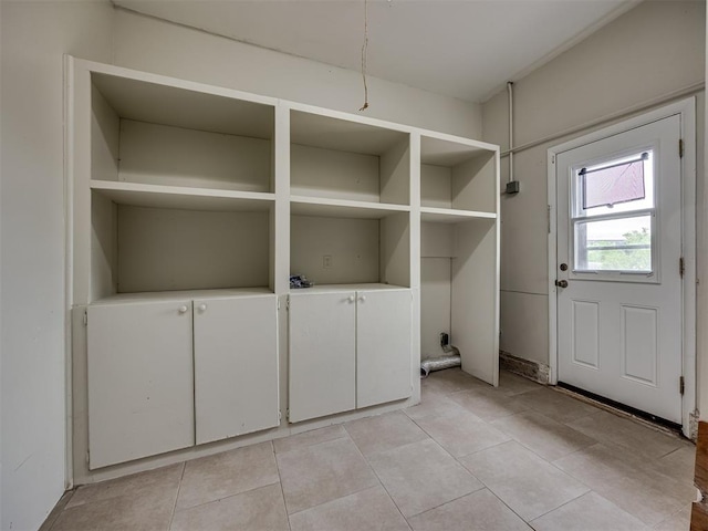 5936 N Ione Dr, Oklahoma City, OK 73122 - laundry area with light tile patterned floors