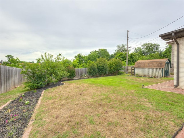 5936 N Ione Dr, Oklahoma City, OK 73122 - fenced backyard with a storage unit