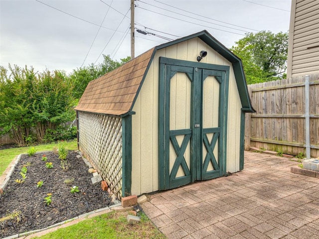 5936 N Ione Dr, Oklahoma City, OK 73122 - view of shed with a fenced backyard