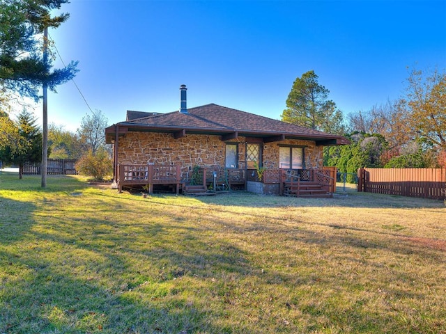 5905 NW 50th St, Oklahoma City, OK 73122 - back of house featuring stone siding and a wooden deck