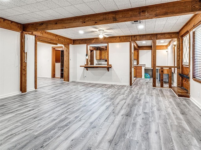 5905 NW 50th St, Oklahoma City, OK 73122 - unfurnished living room with light wood finished floors, ceiling fan, and wooden walls