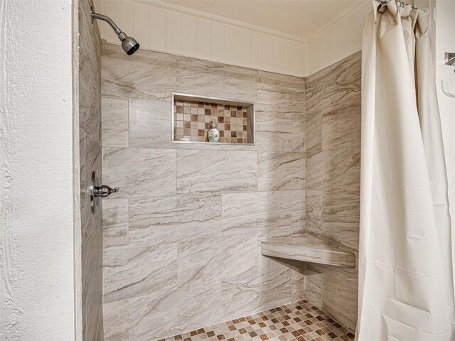 5905 NW 50th St, Oklahoma City, OK 73122 - bathroom featuring crown molding and tiled shower