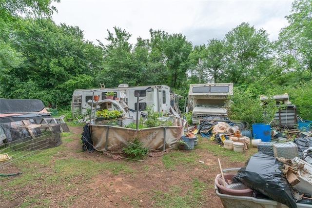 17856 Beechnut Ln, Alex, OK 73003 - view of yard featuring a vegetable garden, a greenhouse, and view of scattered trees