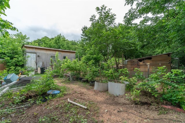17856 Beechnut Ln, Alex, OK 73003 - view of yard featuring an outbuilding and a garden